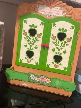 Strawberry shortcake cabinet with 2 characters